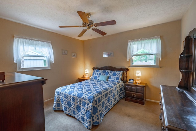 591 Knights Ave, Columbus, OH 43230 - bedroom with carpet flooring, a textured ceiling, and a ceiling fan