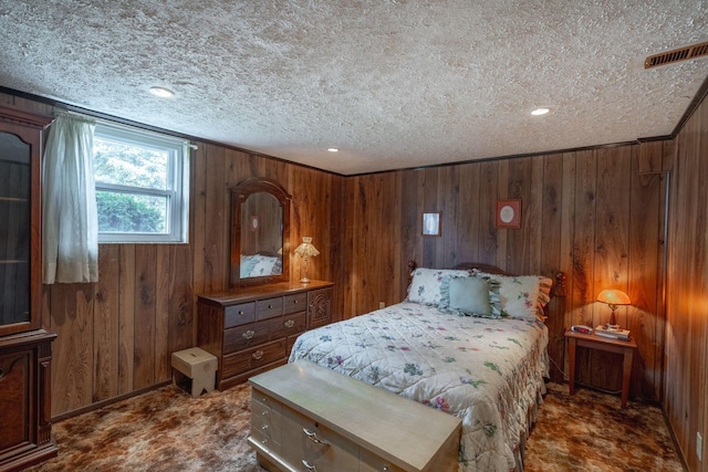 591 Knights Ave, Columbus, OH 43230 - bedroom featuring dark carpet, wood walls, a textured ceiling, and recessed lighting