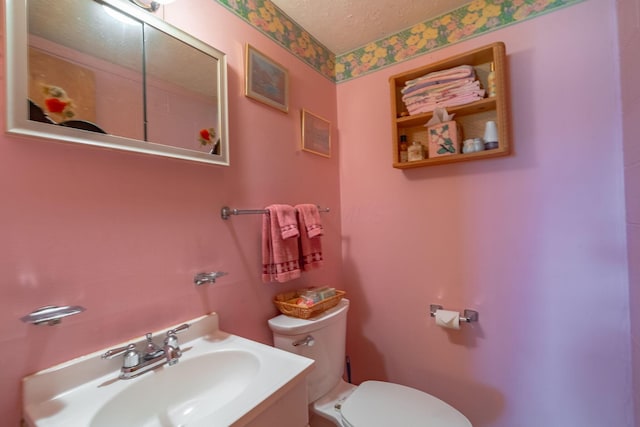 591 Knights Ave, Columbus, OH 43230 - half bathroom featuring a textured ceiling and vanity