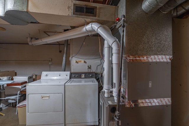 591 Knights Ave, Columbus, OH 43230 - laundry room with washer and clothes dryer and heating unit