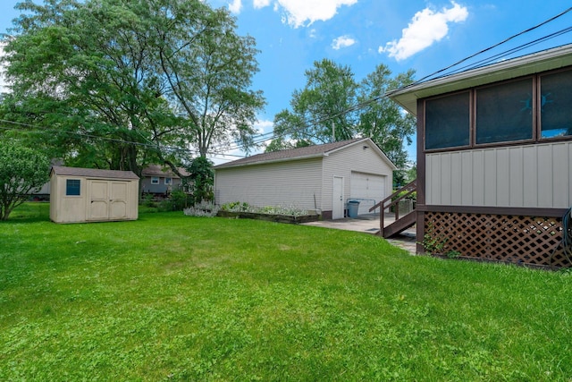 591 Knights Ave, Columbus, OH 43230 - view of grassy yard featuring an outdoor structure and a detached garage