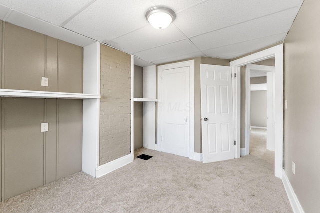 334 S Richardson Ave, Columbus, OH 43204 - unfurnished bedroom featuring carpet, a drop ceiling, and a closet