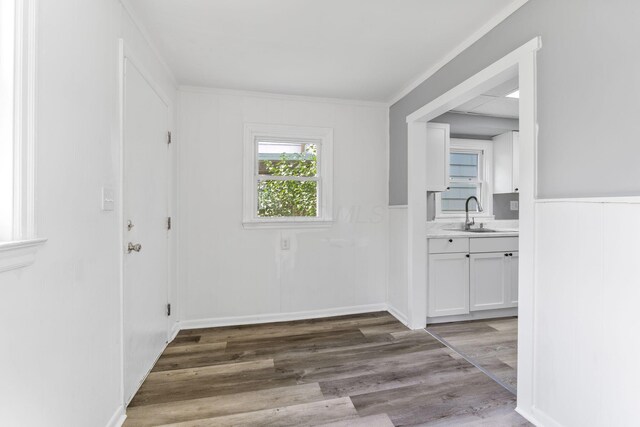 334 S Richardson Ave, Columbus, OH 43204 - hall with wood finished floors, a wainscoted wall, and ornamental molding