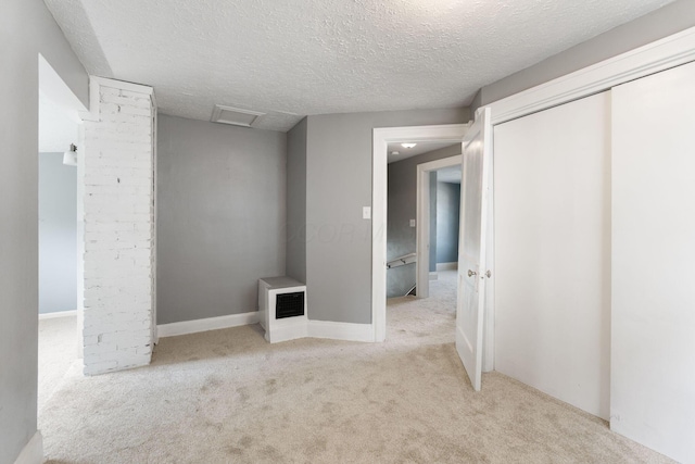 334 S Richardson Ave, Columbus, OH 43204 - unfurnished bedroom featuring carpet, a closet, attic access, and a textured ceiling