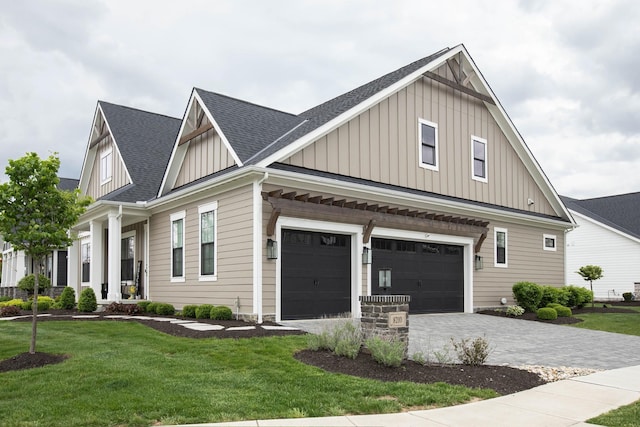 8210 Lilium Way, Plain City, OH 43064 - view of front facade with board and batten siding, roof with shingles, and a front yard
