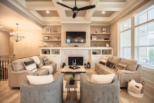 8210 Lilium Way, Plain City, OH 43064 - living area featuring healthy amount of natural light, light wood-type flooring, a ceiling fan, ornamental molding, and a chandelier