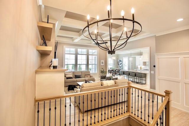 8210 Lilium Way, Plain City, OH 43064 - staircase featuring a chandelier, coffered ceiling, beam ceiling, ornamental molding, and wood finished floors