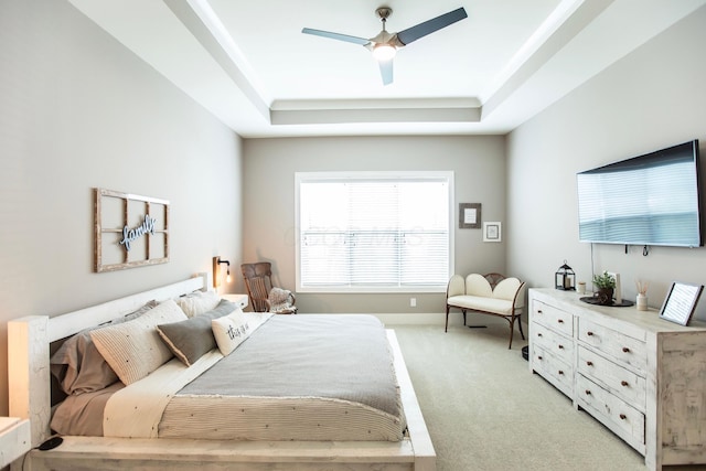 8210 Lilium Way, Plain City, OH 43064 - bedroom featuring a raised ceiling, light colored carpet, and a ceiling fan