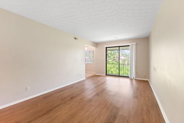 3204 Chateau Morse Ct, Columbus, OH 43231 - spare room with wood finished floors, baseboards, and a textured ceiling