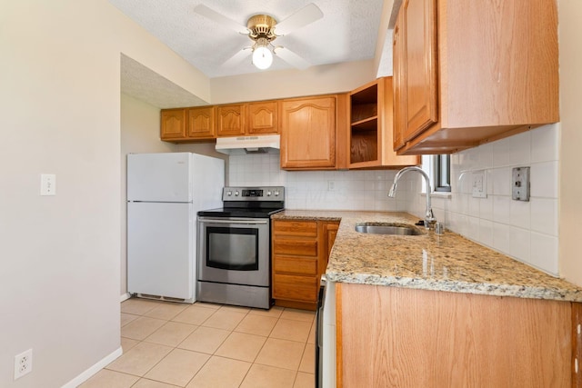 3204 Chateau Morse Ct, Columbus, OH 43231 - kitchen featuring stainless steel range with electric stovetop, freestanding refrigerator, under cabinet range hood, a sink, and tasteful backsplash