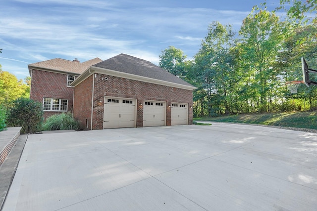 125 Fallen Ash Dr, Granville, OH 43023 - view of property exterior featuring brick siding, concrete driveway, and an attached garage