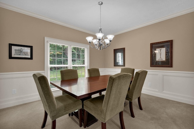 125 Fallen Ash Dr, Granville, OH 43023 - dining area with a chandelier, crown molding, light colored carpet, wainscoting, and a decorative wall