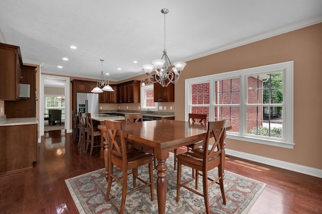 125 Fallen Ash Dr, Granville, OH 43023 - dining area with a chandelier, ornamental molding, dark wood-style flooring, and recessed lighting