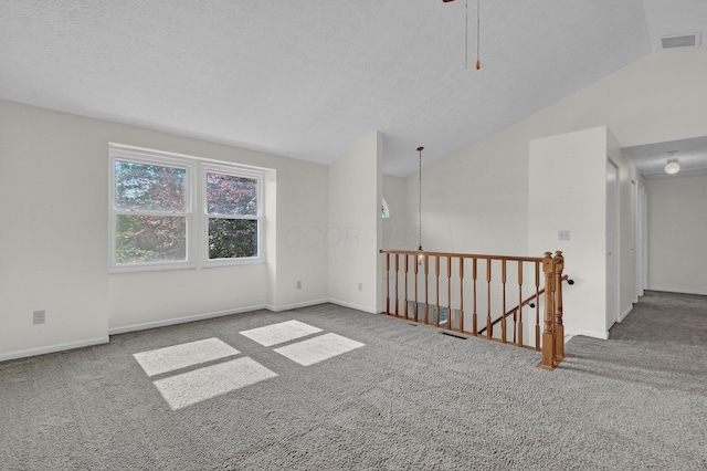 7879 Sudeley Ct, Westerville, OH 43081 - unfurnished room with vaulted ceiling, carpet flooring, and a ceiling fan