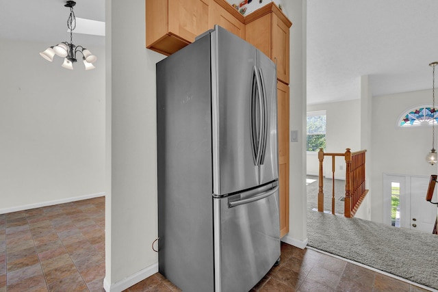 7879 Sudeley Ct, Westerville, OH 43081 - kitchen featuring freestanding refrigerator, a chandelier, and pendant lighting