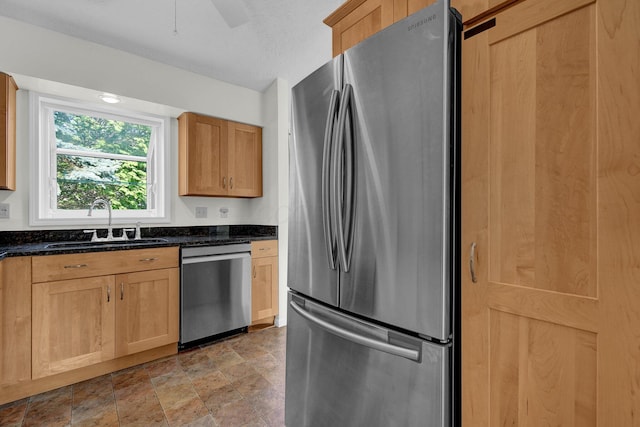 7879 Sudeley Ct, Westerville, OH 43081 - kitchen with appliances with stainless steel finishes, dark stone countertops, and stone finish floors
