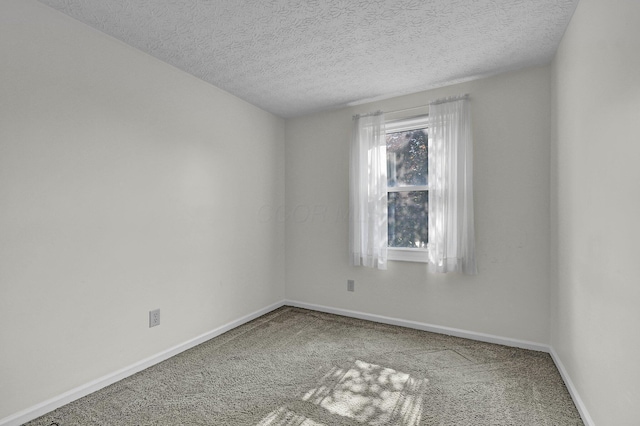 7879 Sudeley Ct, Westerville, OH 43081 - carpeted empty room with baseboards and a textured ceiling