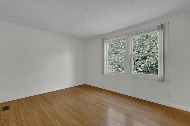 7879 Sudeley Ct, Westerville, OH 43081 - empty room featuring hardwood / wood-style floors and a textured ceiling