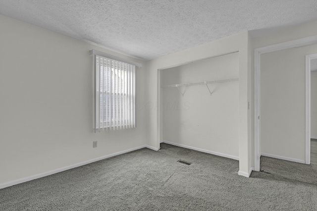 7879 Sudeley Ct, Westerville, OH 43081 - unfurnished bedroom featuring carpet flooring, a closet, and a textured ceiling