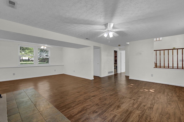7879 Sudeley Ct, Westerville, OH 43081 - unfurnished room with a ceiling fan, dark wood-type flooring, and a textured ceiling