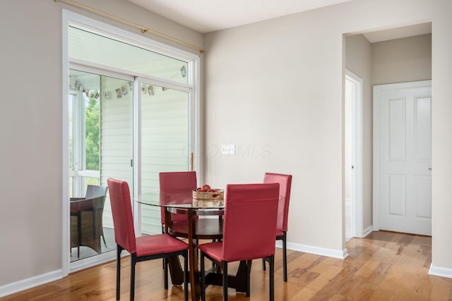 4609 Stoneworth Dr Unit 58, Hilliard, OH 43026 - dining room with plenty of natural light, wood finished floors, and baseboards