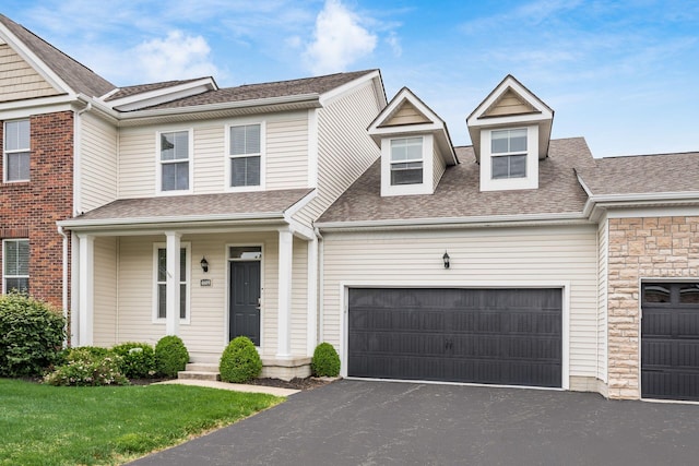 4609 Stoneworth Dr Unit 58, Hilliard, OH 43026 - townhome / multi-family property with an attached garage, asphalt driveway, and a shingled roof