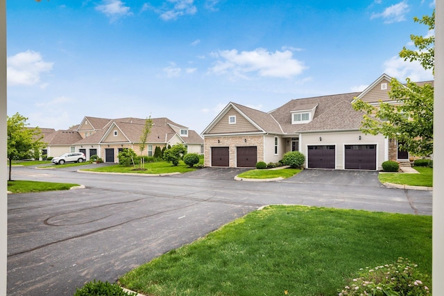 4609 Stoneworth Dr Unit 58, Hilliard, OH 43026 - view of front of property with an attached garage, a front yard, driveway, and a residential view