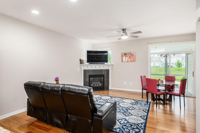4609 Stoneworth Dr Unit 58, Hilliard, OH 43026 - living room with ceiling fan, wood finished floors, a tile fireplace, baseboards, and recessed lighting