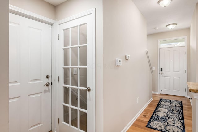 4609 Stoneworth Dr Unit 58, Hilliard, OH 43026 - doorway to outside featuring light wood-style floors and baseboards