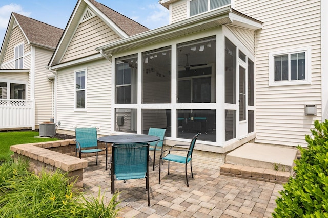 4609 Stoneworth Dr Unit 58, Hilliard, OH 43026 - view of patio featuring a sunroom, outdoor dining area, and central AC