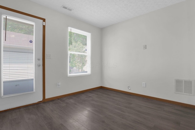 3062 Nomination Ln Unit 260, Columbus, OH 43207 - empty room featuring dark wood-style flooring and a textured ceiling