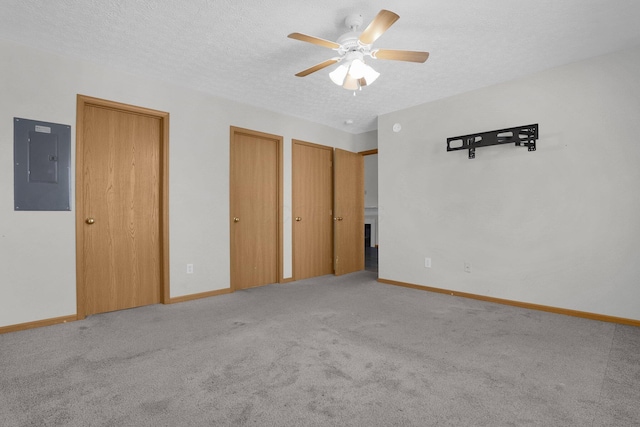 3062 Nomination Ln Unit 260, Columbus, OH 43207 - unfurnished bedroom featuring electric panel, two closets, carpet floors, a textured ceiling, and a ceiling fan