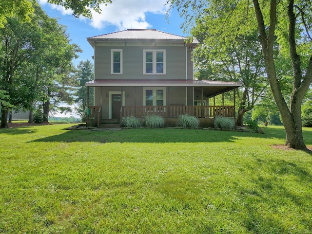 1803 County Road 26, Marengo, OH 43334 - back of house featuring covered porch, a lawn, and a metal roof