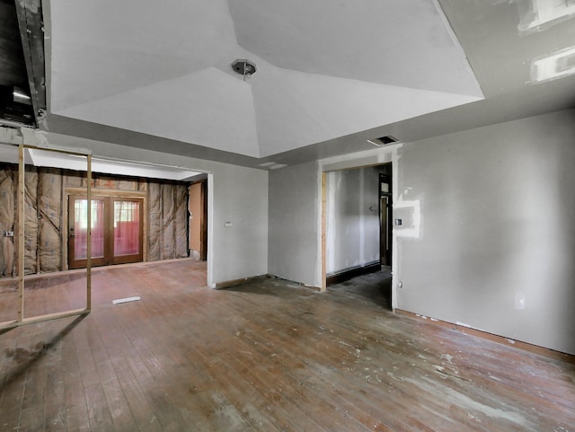 1803 County Road 26, Marengo, OH 43334 - spare room featuring wood-type flooring and vaulted ceiling