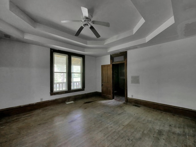 1803 County Road 26, Marengo, OH 43334 - empty room with a raised ceiling, wood finished floors, and a ceiling fan