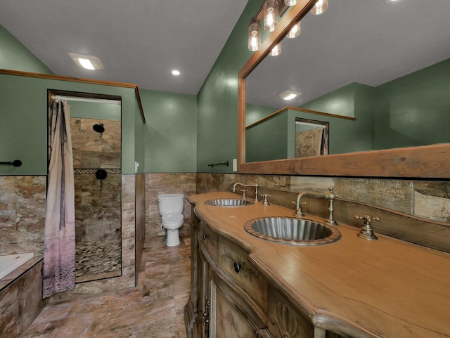 1803 County Road 26, Marengo, OH 43334 - full bathroom featuring tile walls, a tile shower, wainscoting, tiled bath, and double vanity