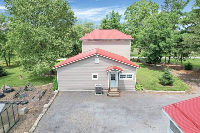 1803 County Road 26, Marengo, OH 43334 - back of property with entry steps, a metal roof, and a yard