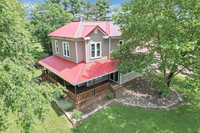 1803 County Road 26, Marengo, OH 43334 - rear view of property with a metal roof, covered porch, and a lawn