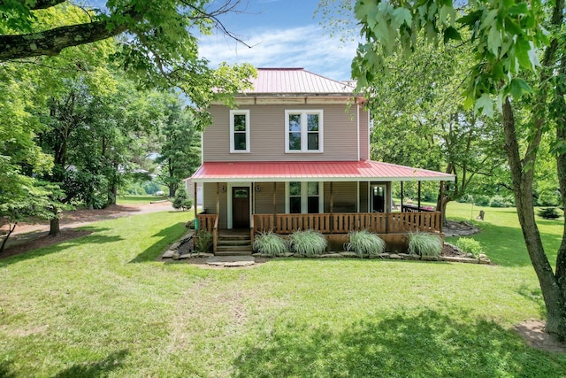 1803 County Road 26, Marengo, OH 43334 - view of front of property with a metal roof, a porch, and a front lawn