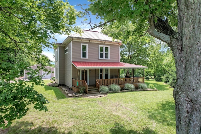 1803 County Road 26, Marengo, OH 43334 - view of front of property featuring a porch, a metal roof, and a front yard