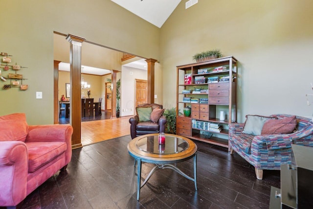 332 Waters Edge Dr, Hebron, OH 43025 - sitting room featuring ornate columns, high vaulted ceiling, and wood finished floors
