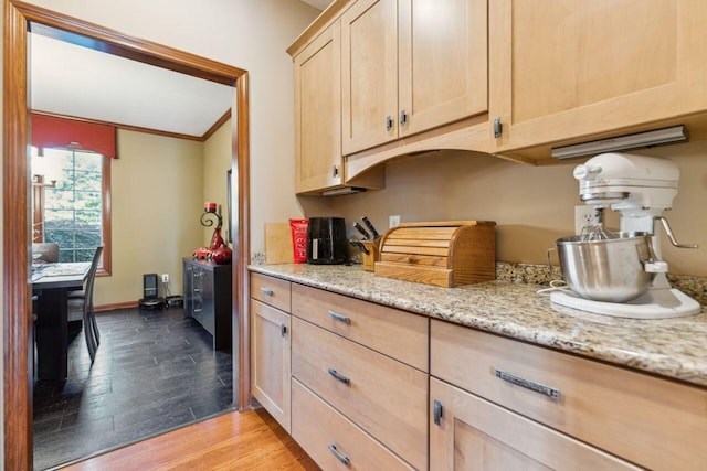 332 Waters Edge Dr, Hebron, OH 43025 - kitchen with light brown cabinets, light wood-type flooring, ornamental molding, and light stone countertops