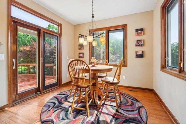 332 Waters Edge Dr, Hebron, OH 43025 - dining space featuring light wood-style flooring and a chandelier