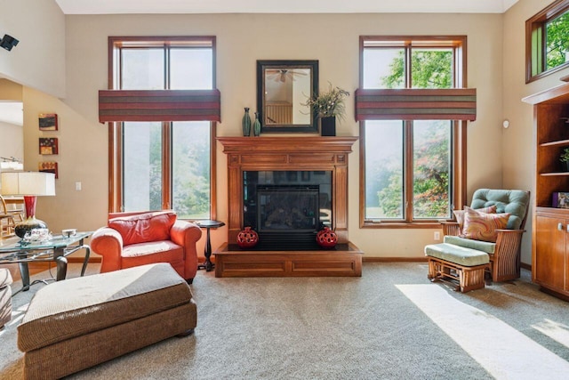 332 Waters Edge Dr, Hebron, OH 43025 - carpeted living room featuring a high ceiling and a glass covered fireplace