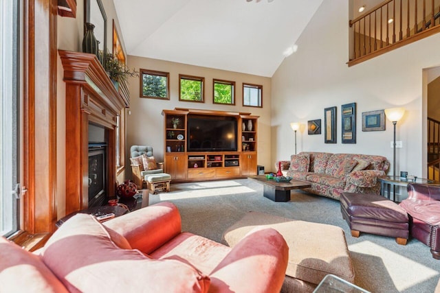 332 Waters Edge Dr, Hebron, OH 43025 - living area featuring high vaulted ceiling, a glass covered fireplace, and carpet floors