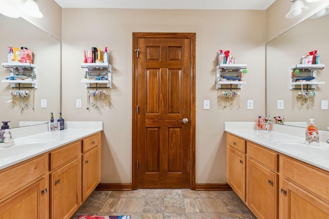 332 Waters Edge Dr, Hebron, OH 43025 - bathroom with two vanities and stone finish floors