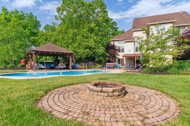 332 Waters Edge Dr, Hebron, OH 43025 - view of grassy yard with a gazebo, an outdoor fire pit, an outdoor pool, and a patio