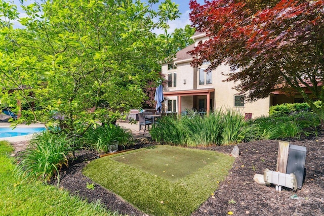 332 Waters Edge Dr, Hebron, OH 43025 - view of yard featuring a patio, an outdoor pool, and a putting area