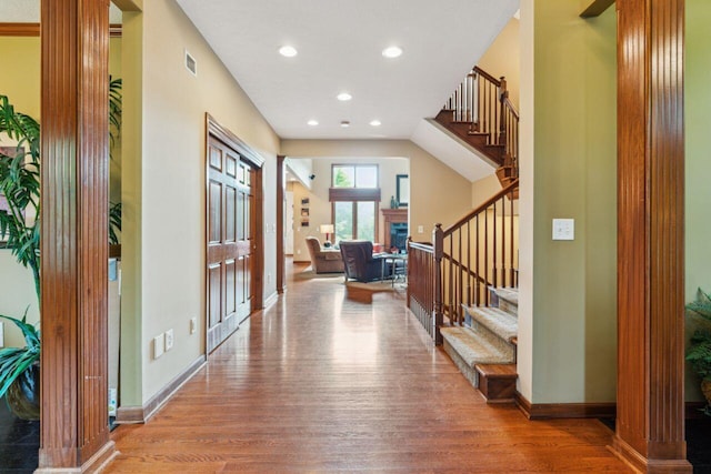 332 Waters Edge Dr, Hebron, OH 43025 - foyer entrance with wood finished floors, stairway, recessed lighting, and a fireplace