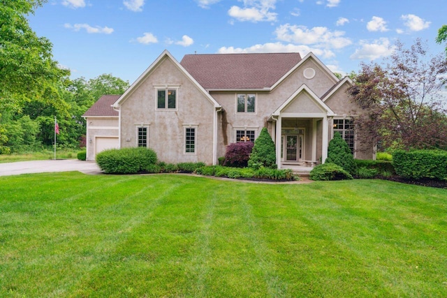 332 Waters Edge Dr, Hebron, OH 43025 - view of front facade featuring a front yard, concrete driveway, and stucco siding